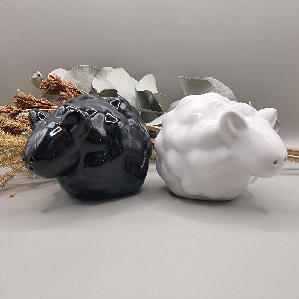 Black and white ceramic sheep salt and pepper shakers in glossy finish.