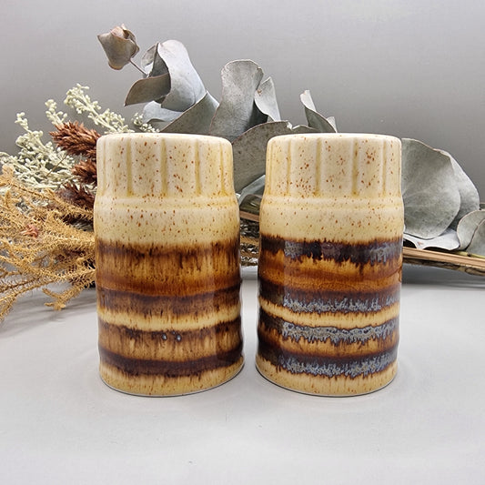 Set of two brown drip glaze ceramic salt and pepper shakers, made in England.