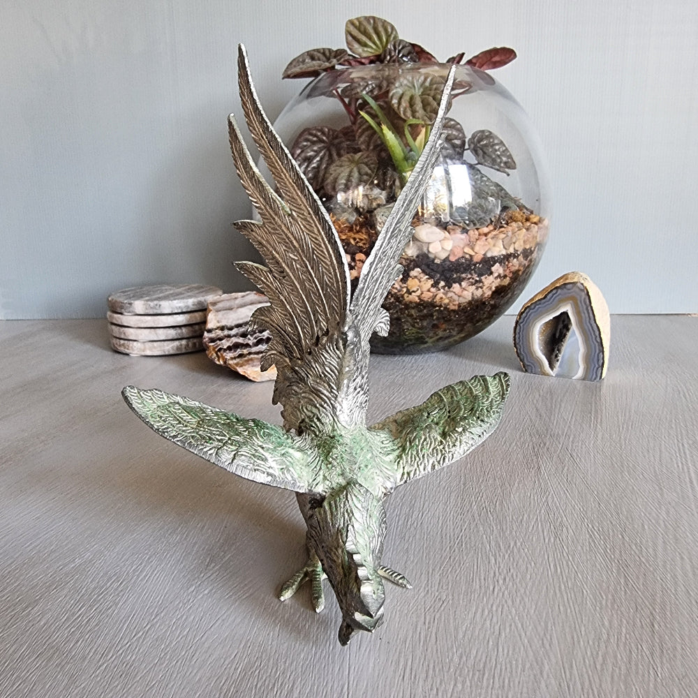 Metal rooster figurine with green patina, raised wings and detailed feathers, Japanese decor.