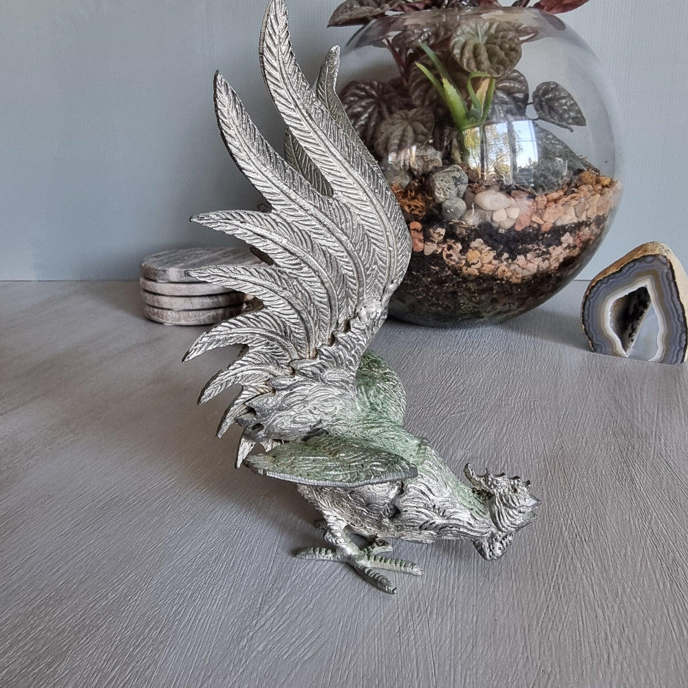 Metal rooster figurine with green patina, raised wings and detailed feathers, Japanese decor.