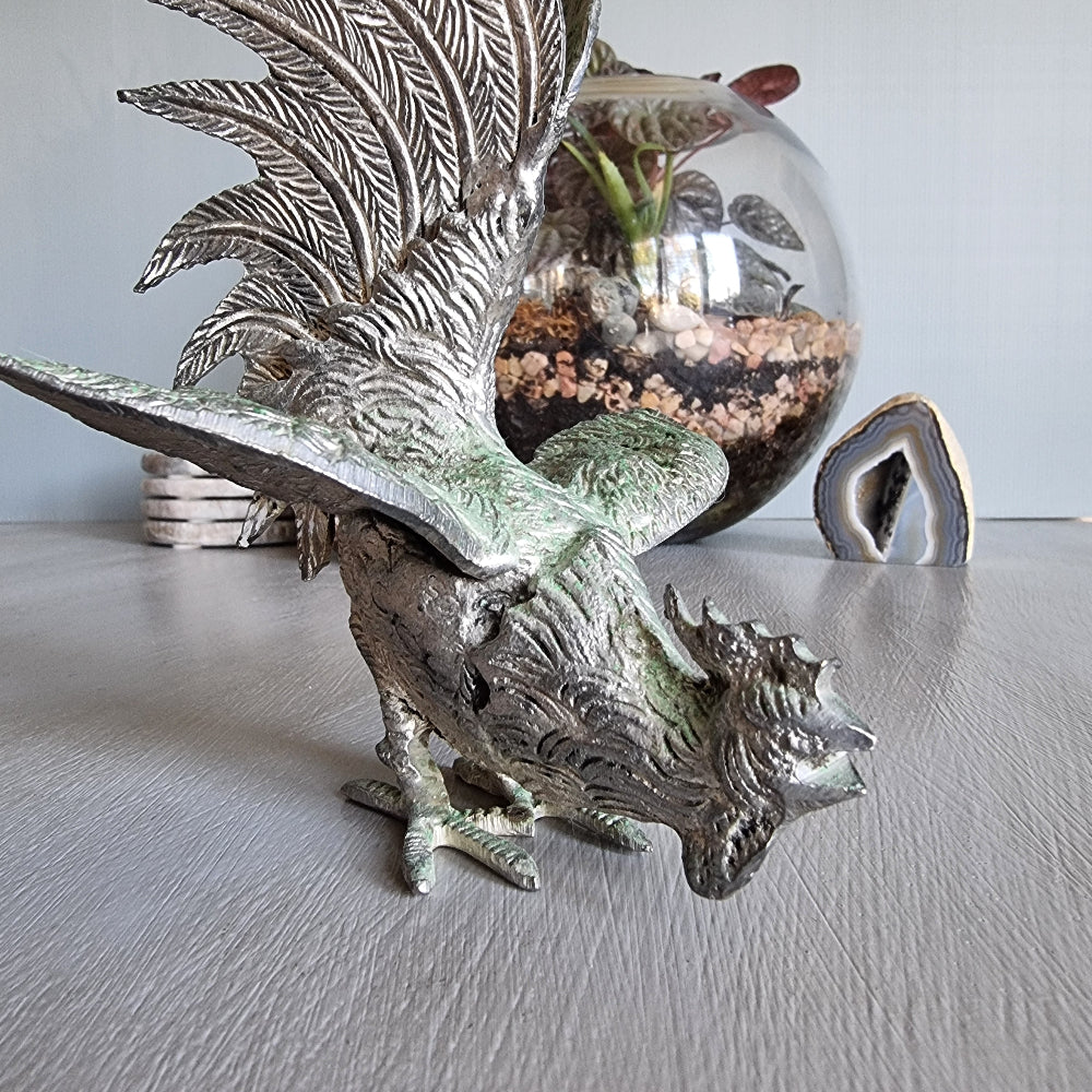 Metal rooster figurine with green patina, raised wings and detailed feathers, Japanese decor.