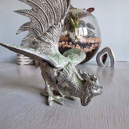 Metal rooster figurine with green patina, raised wings and detailed feathers, Japanese decor.