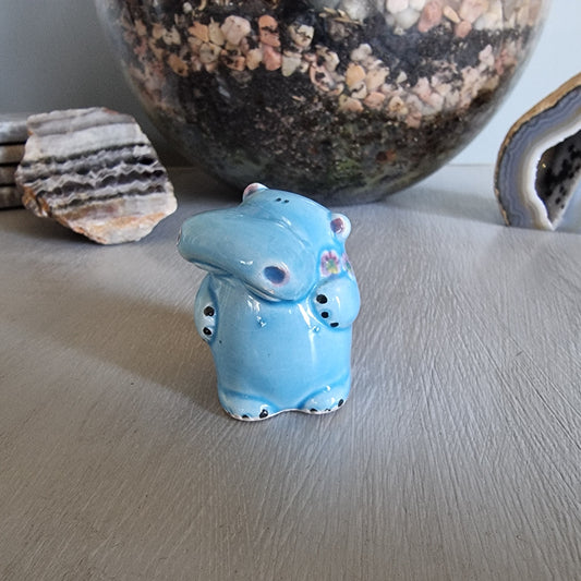 Vintage blue ceramic hippo toothpick holder with floral detail and open back cavity