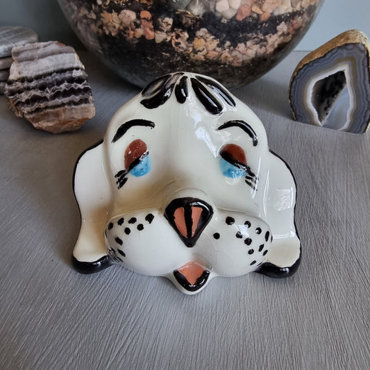Vintage ceramic dog glasses holder with painted face and black accents.