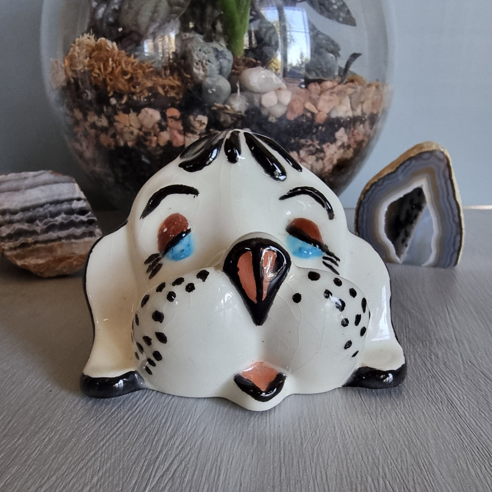 Vintage ceramic dog glasses holder with painted face and black accents.
