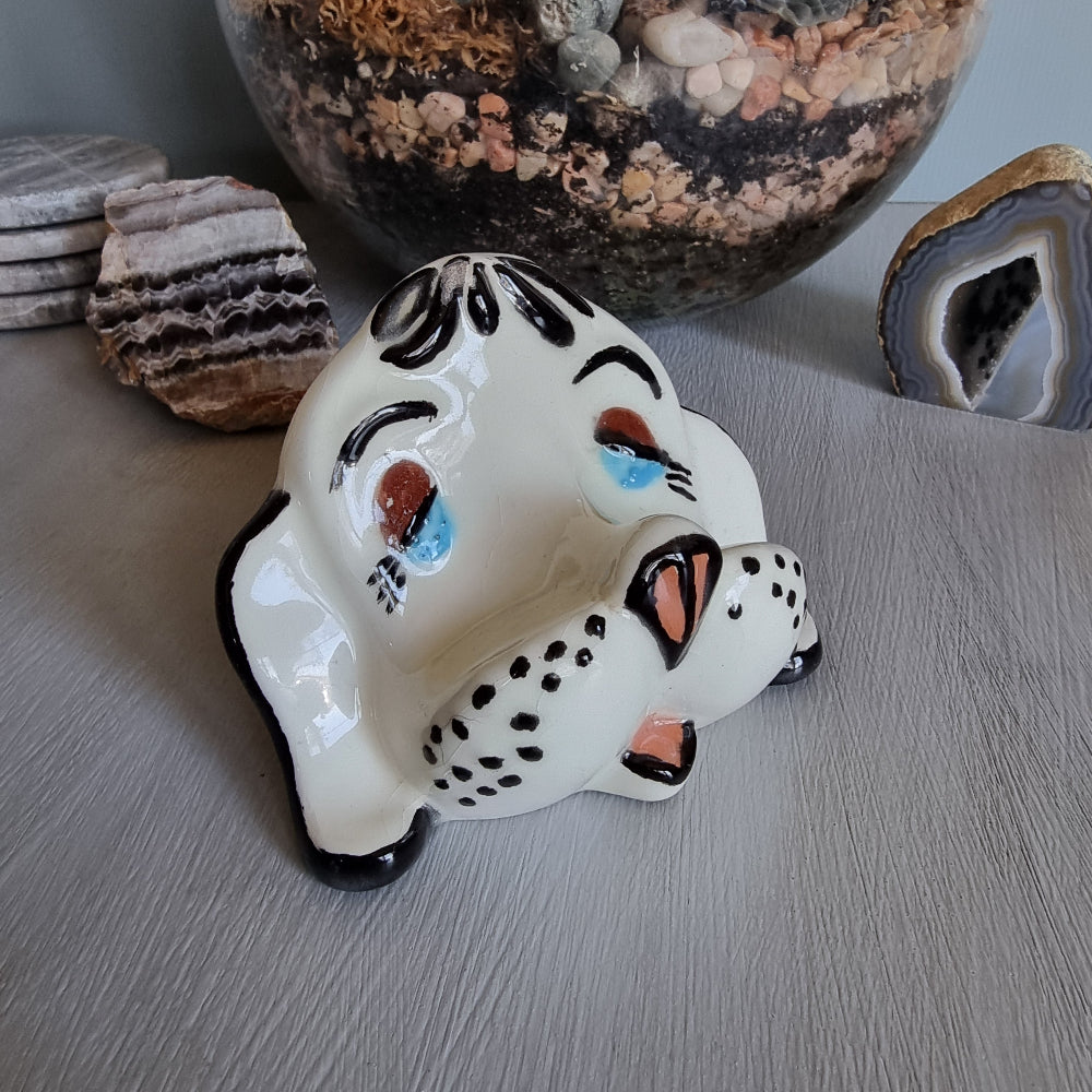 Vintage ceramic dog glasses holder with painted face and black accents.