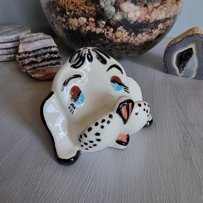 Vintage ceramic dog glasses holder with painted face and black accents.