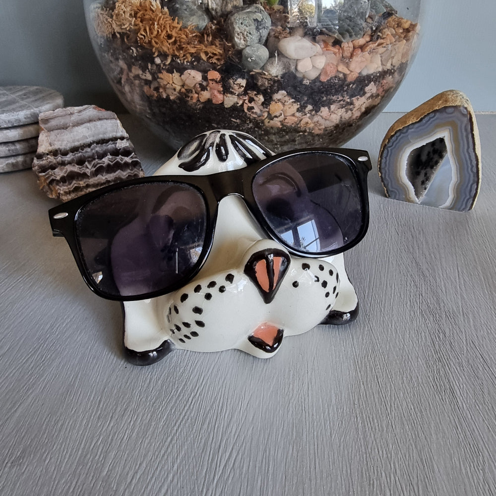 Vintage ceramic dog glasses holder with painted face and black accents.