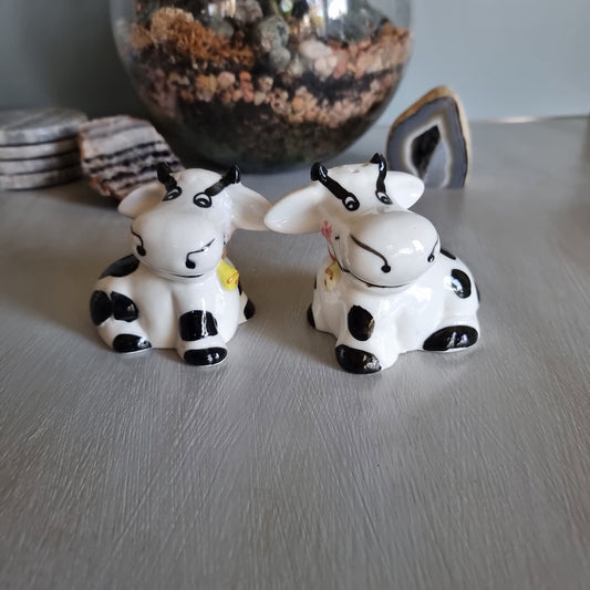 Ceramic cow salt and pepper shakers with black spots and yellow cowbells