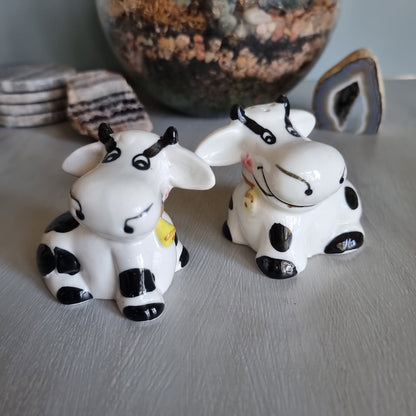 Ceramic cow salt and pepper shakers with black spots and yellow cowbells