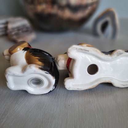 Pair of vintage ceramic beagle salt and pepper shakers with red collars.