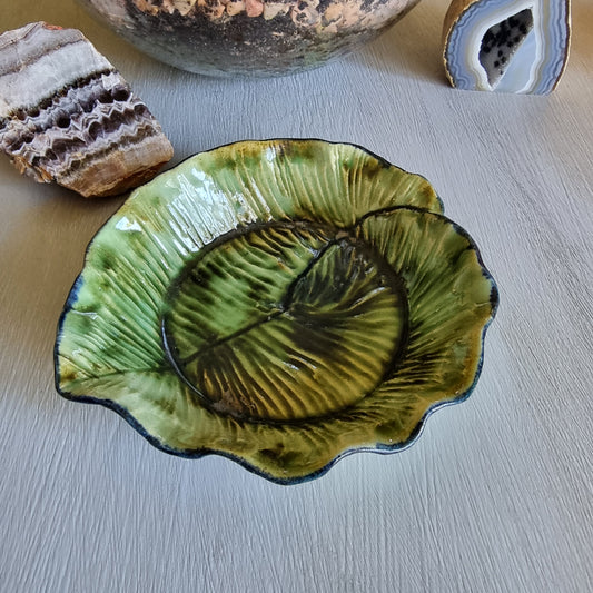 Vintage green majolica-style cabbage leaf dish with textured veining and ruffled edge