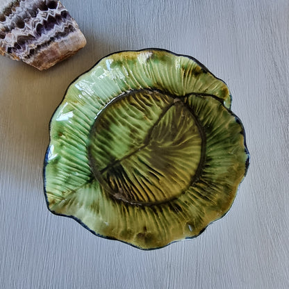 Vintage green majolica-style cabbage leaf dish with textured veining and ruffled edge