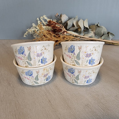 Set of 4 Poole Pottery Springtime bowls with pastel floral decoration.