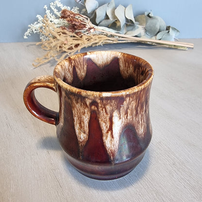 Crown Lynn drip glaze mug in brown and cream tones.