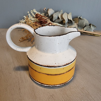 Stonehenge Midwinter Sun pitcher with yellow and ochre bands, made in England.