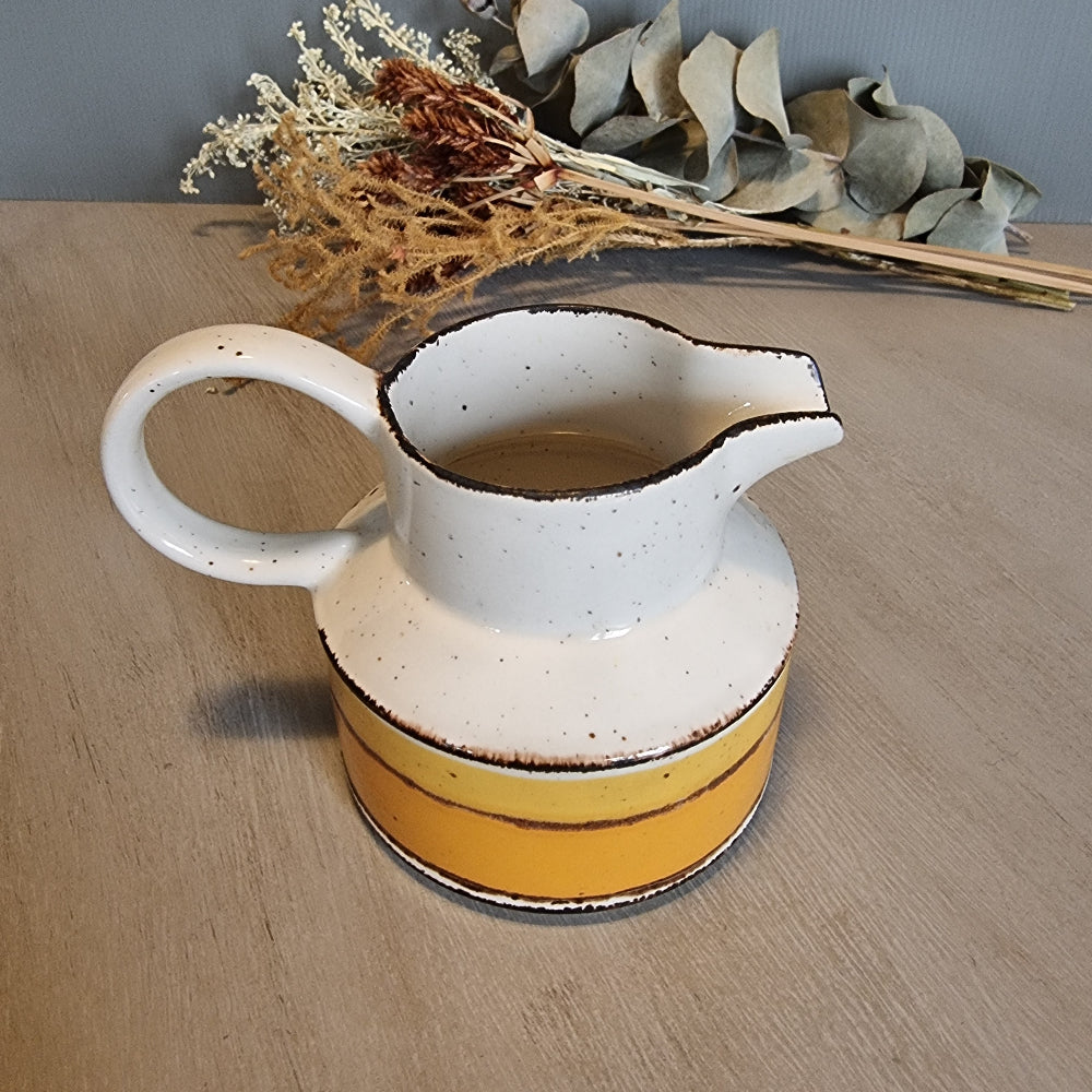 Stonehenge Midwinter Sun pitcher with yellow and ochre bands, made in England.