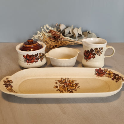 Vintage floral ceramic tea set with tray, jug, bowl and lidded pot.