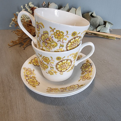 Pair of Royal Vale bone china cups and saucer with vintage floral design.
