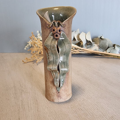 Sharon Twining handcrafted ceramic vase with gumleaf and gumnut design, earthy Australian pottery.