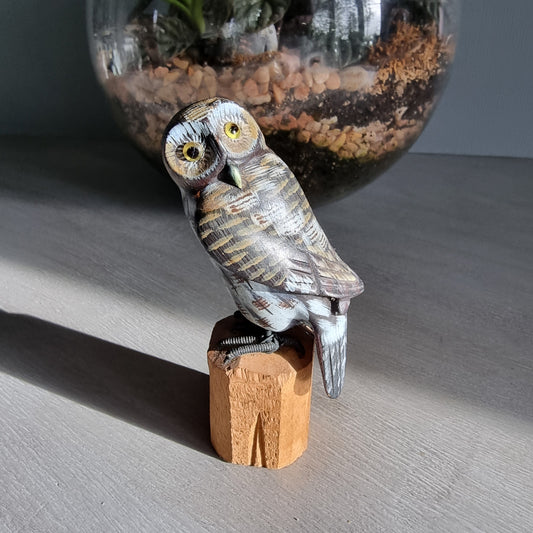 Hand-carved wooden owl ornament with painted feather details.