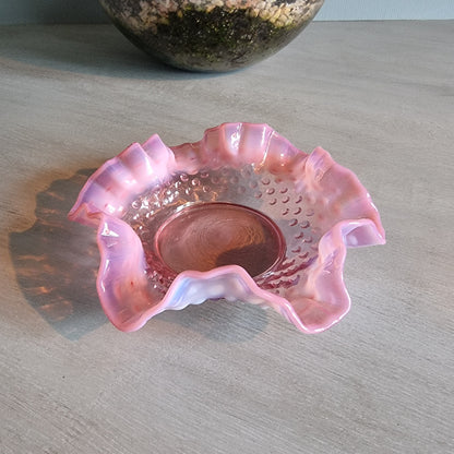 Vintage Fenton pink opalescent hobnail glass bowl with ruffled edge.