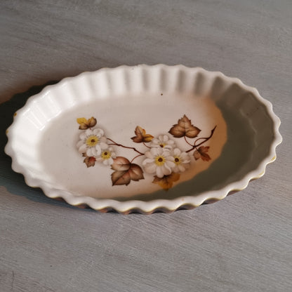 Kermiko Potteries flan dish with floral pattern and scalloped edge.
