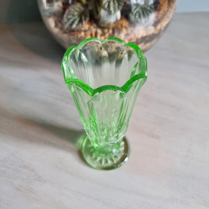 Vintage green Depression glass vase with scalloped rim.