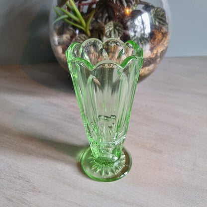 Vintage green Depression glass vase with scalloped rim.