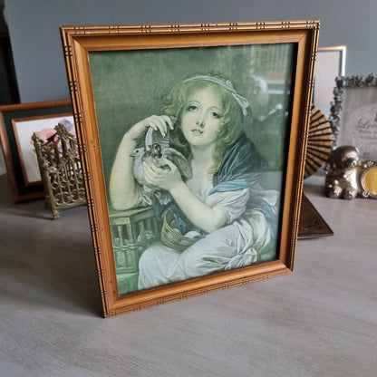 Vintage girl with doves framed print in bamboo-style frame