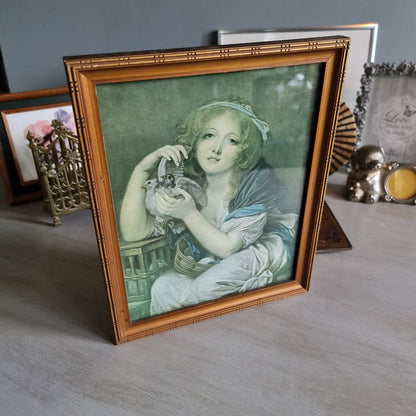 Vintage girl with doves framed print in bamboo-style frame