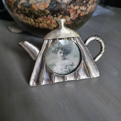 Vintage pewter teapot-shaped photo frame with round window