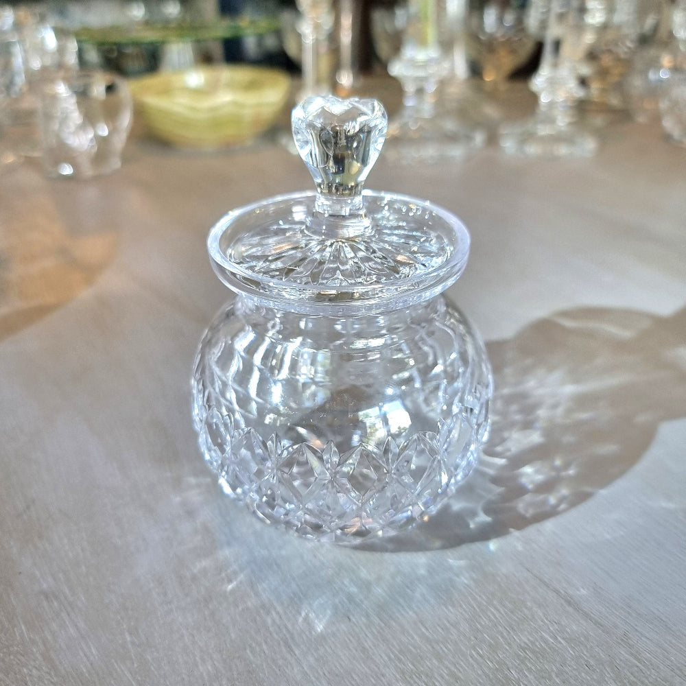 Pressed glass jam jar with faceted lid handle and diamond-cut pattern.
