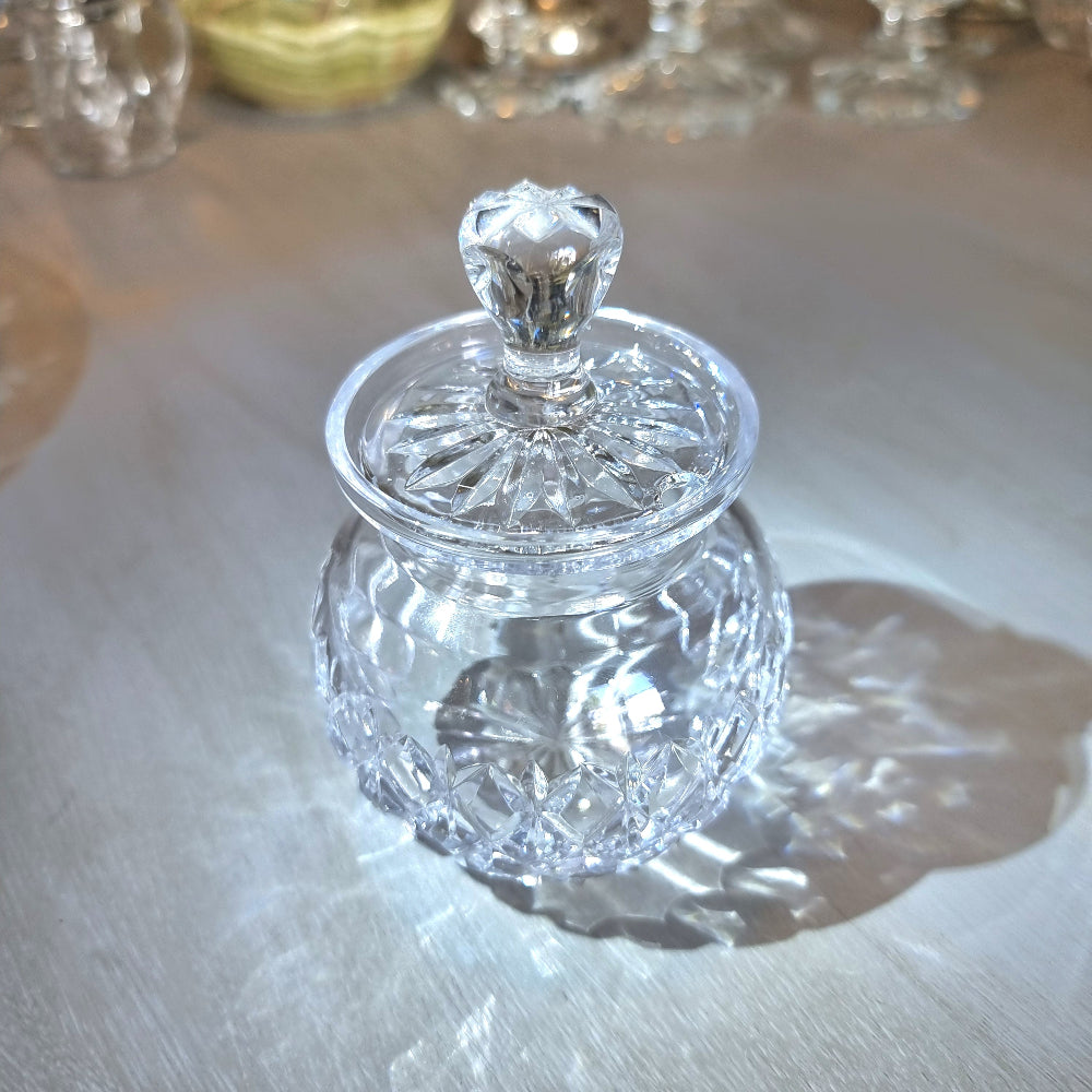 Pressed glass jam jar with faceted lid handle and diamond-cut pattern.