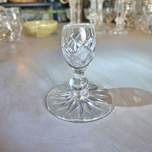 Crystal candle holder with egg-shaped cut-glass cup and starburst base.