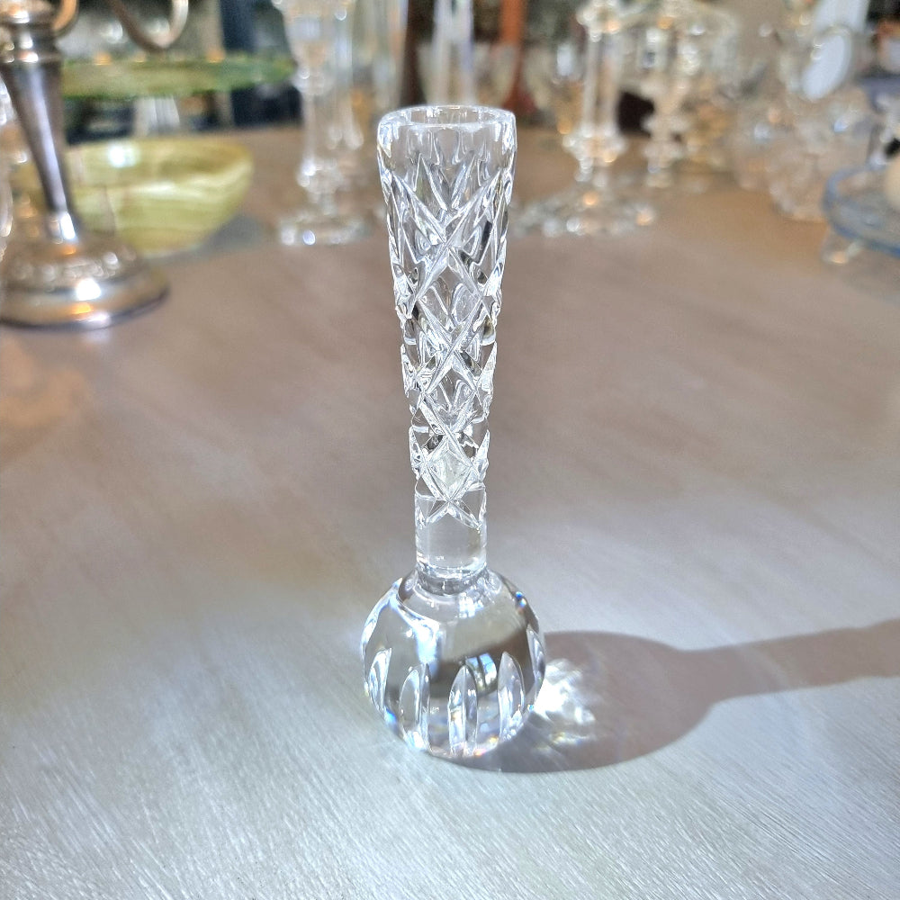Crystal bud vase with lattice-cut stem and rounded faceted base.
