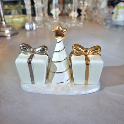 Ceramic Christmas salt and pepper shakers shaped like gift boxes with a tree in the centre.