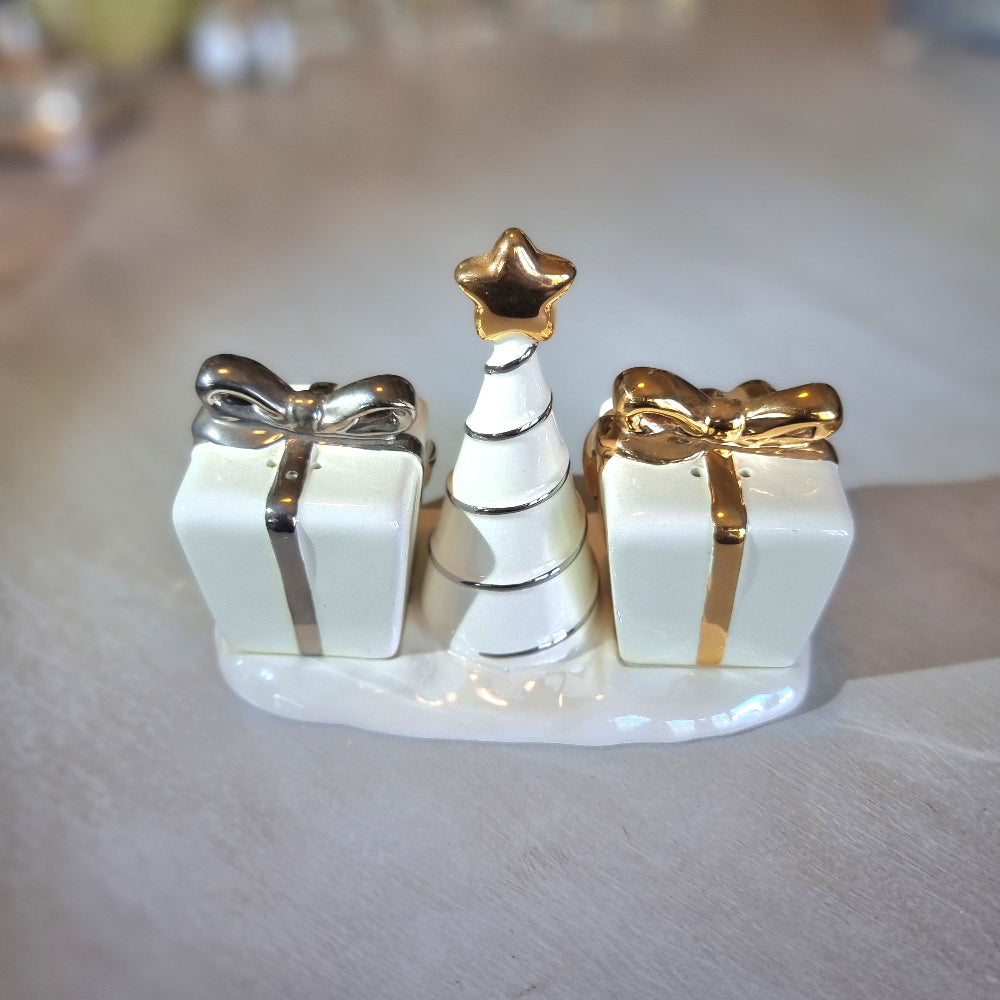 Ceramic Christmas salt and pepper shakers shaped like gift boxes with a tree in the centre.