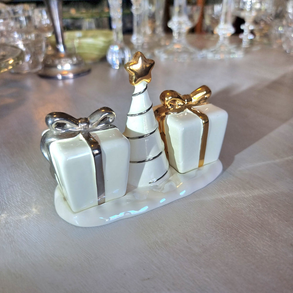 Ceramic Christmas salt and pepper shakers shaped like gift boxes with a tree in the centre.