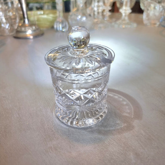 Small crystal jam jar with starburst lid and faceted cut-glass pattern.