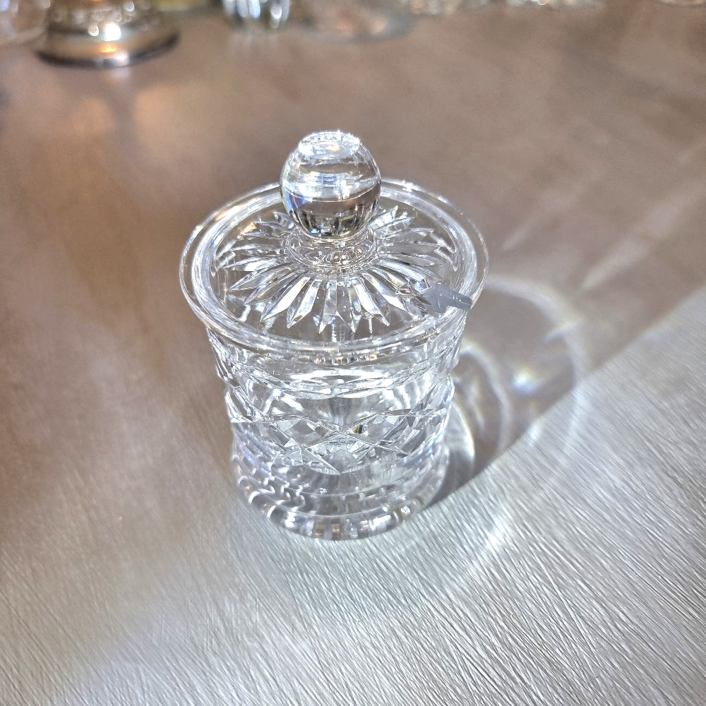 Small crystal jam jar with starburst lid and faceted cut-glass pattern.