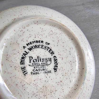 Vintage Palissy England dish with yellow and orange floral design and speckled glaze.