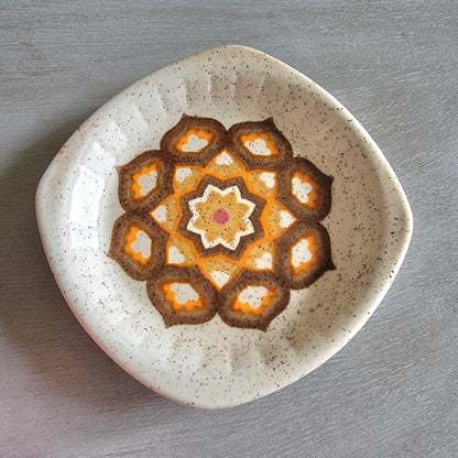 Vintage Palissy geometric dish with orange and brown 70s pattern on speckled glaze.