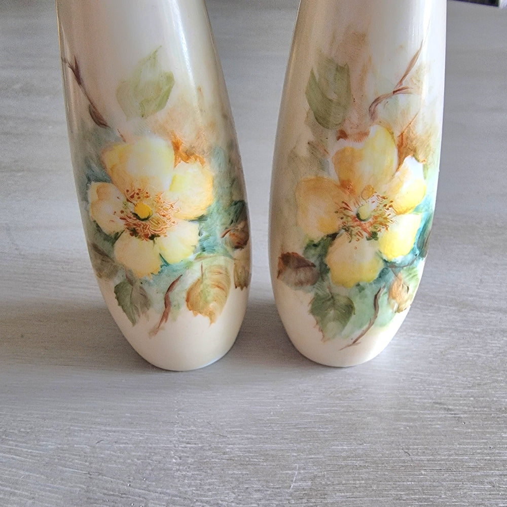 Hand-painted floral salt and pepper shakers with yellow flowers by Maude Hinde.