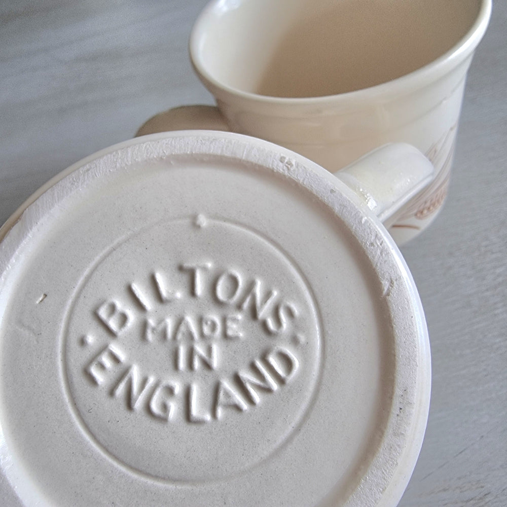 Pair of Biltons England stoneware mugs with brown wheat and berry design.