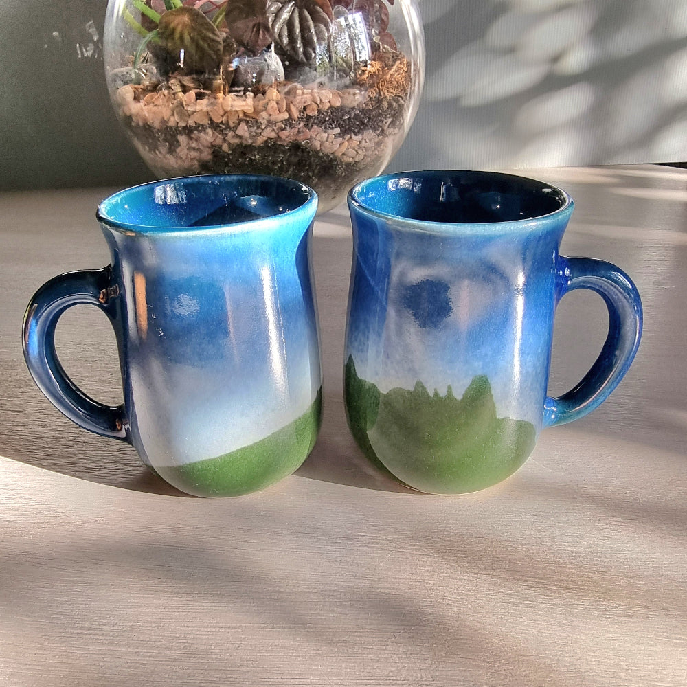 Matching vintage stoneware mugs with blue and green hand-glazed finish