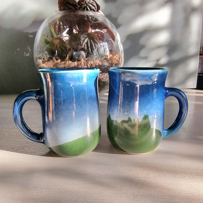 Matching vintage stoneware mugs with blue and green hand-glazed finish