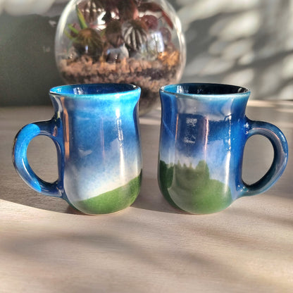 Matching vintage stoneware mugs with blue and green hand-glazed finish