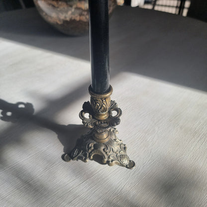 Ornate brass candlestick with detailed tri-foot base stamped Made in Italy.