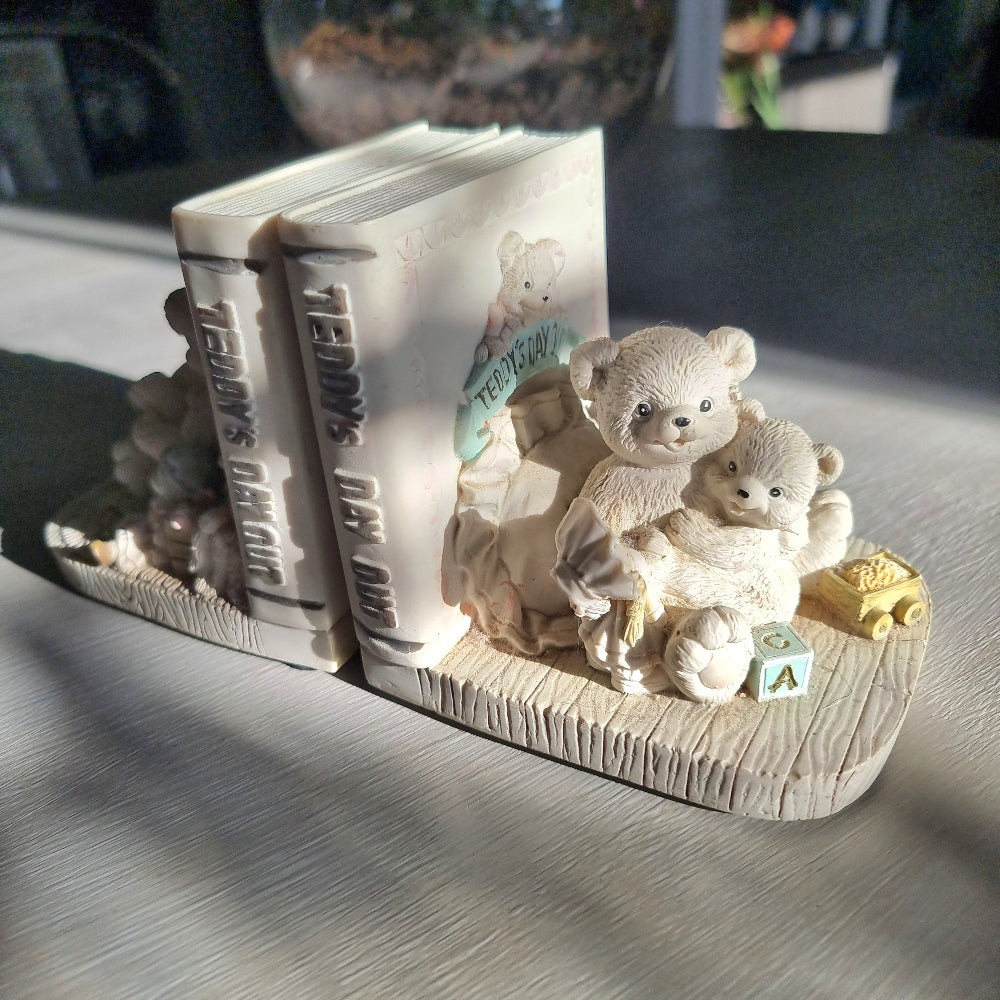 Teddy’s Day Out teddy bear bookends with bears reading and playing beside decorative books.